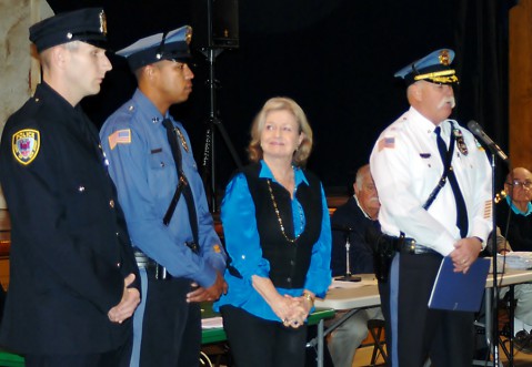 Patrolmen Matthew Clark and Aaron Rock receive the “Life Saving Award” from Diane Vanvliet and Chief Winans. 
