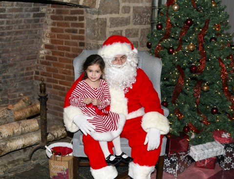 Sofia Ferragina (3) of West Long Branch has fun with Santa at the Christmas Party held at the WLB Community Center on December 21.