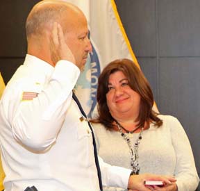 Goldfarb is sworn in with his wife looking on